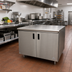 Thumbnail image #2 for Advance Tabco 48 in. W x 30 in. D 14-Gauge 304 Stainless Steel Enclosed Work Table with Cabinet Base and Hinged Doors