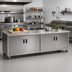 Thumbnail image #2 for Advance Tabco Special Value Series 96 Inch x 30 Inch Enclosed Work Table with Cabinet Base, Hinged Doors, and 16 Gauge 304 Stainless Steel Top