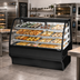 Thumbnail image #3 for True Specialty Display Dry Full-Service Pastry Display Case, 59-1/4 Inch, Curved Glass Front, Stainless Steel, 3-Tier Shelves