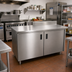 Thumbnail image #2 for Advance Tabco Special Value Economy Enclosed Work Table with Sliding Door Cabinet Base, 120 x 24 Inches, 16 Gauge 304 Stainless Steel Top