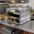 Thumbnail image #2 for Henny Penny MPC222.03 Pass-Through Dual-Access Modular Heated Holding Cabinet, 4 Drawer Pans, 2-Tier, 120V