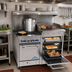 Thumbnail image #2 for Comstock-Castle F3218-36B 48-Inch Commercial Gas Range with 2 Open Burners, 36-Inch Raised Griddle, and 2 Space-Saver Ovens