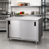 Thumbnail image #2 for Advance Tabco Special Value Economy Enclosed Work Table with Cabinet Base, Sliding Doors and Mid-Shelf, 120W x 30D, 16 Gauge 304 Stainless Steel Top