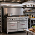 Thumbnail image #2 for Ultimate 48-Inch Gas Restaurant Range with 4 Star/Sauté Burners, 24-Inch Griddle, and 2 Space Saver Ovens