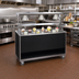 Thumbnail image #2 for Vollrath 2-Series Affordable Portable 46-Inch Mobile Solid Top Utility Station with Buffet Breath Guard, Lights, and Open Storage Base