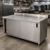 Thumbnail image #2 for Advance Tabco 144-Inch x 30-Inch Enclosed Work Table with Cabinet Base, Sliding Doors, and 14-Gauge 304 Stainless Steel Top