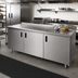 Thumbnail image #2 for Advance Tabco 108-Inch x 24-Inch Enclosed Stainless Steel Work Table with 14-Gauge 304 Top, Cabinet Base, and Hinged Doors