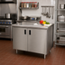 Thumbnail image #2 for Advance Tabco Special Value 36 x 24 Inch Enclosed Work Table with Cabinet Base, Mid-Shelf, Hinged Doors, and 16 Gauge 304 Stainless Steel Top