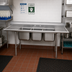 Thumbnail image #2 for Advance Tabco Regaline Floor Model 3-Compartment Sink with Left and Right Drainboards, 20 x 20-Inch Bowls, Open Frame Base, 18 Gauge 304 Stainless Steel