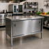 Thumbnail image #2 for John Boos Enclosed Stainless Steel Work Table with Sliding Doors, 72 x 30 Inches, 14-Gauge 300 Series Flat Top