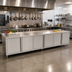 Thumbnail image #2 for John Boos 144 Inch x 30 Inch Enclosed Work Table with Cabinet Base, 16 Gauge Stainless Steel Top, 3 Hinged Doors, 1-1/2 Inch Rear Riser
