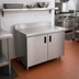 Thumbnail image #2 for Advance Tabco Enclosed Work Table with Cabinet Base and Hinged Doors, 72 x 24 Inch, 14 Gauge 304 Stainless Steel Top, 5 Inch Backsplash