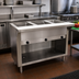 Thumbnail image #2 for Advance Tabco Triumph Supreme 47-1/8-Inch Stainless Steel Natural Gas 3-Well Open-Well Commercial Steam Table with Enclosed Base and Cutting Board Shelf
