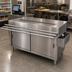 Thumbnail image #2 for BK Resources Stainless Steel Cashier-Serve Counter with Sliding Doors and Door-Side Urn Trough, 72W x 30D