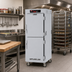 Thumbnail image #2 for Metro C5 8 Series Mobile Full-Height Pass-Thru Controlled Temperature Holding Cabinet with Solid Dutch Doors, 17-Pan Capacity