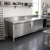 Thumbnail image #2 for John Boos Enclosed Work Table with Sliding Door Cabinet Base, 132-Inch x 30-Inch, 14-Gauge 300-Series Stainless Steel Top, 5-Inch Backsplash