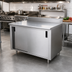 Thumbnail image #2 for Advance Tabco 48-Inch x 30-Inch Enclosed Work Table with 14-Gauge 304 Stainless Steel Top, Cabinet Base, Sliding Doors, Mid-Shelf, and 5-Inch Backsplash