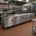 Thumbnail image #2 for Advance Tabco Enclosed Work Table with Cabinet Base and Hinged Doors, 144 x 36 Inches, 14 Gauge 304 Stainless Steel Top
