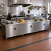 Thumbnail image #2 for Advance Tabco 144-Inch x 36-Inch Enclosed Work Table with Cabinet Base, Mid-Shelf and Hinged Doors