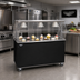 Thumbnail image #2 for Vollrath 2-Series Affordable Portable 46-Inch Mobile Utility Station with Stainless Steel Top, Lighted Buffet Breath Guard, and Sliding Door Storage Base