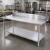 Thumbnail image #2 for Advance Tabco 120-Inch x 36-Inch 14-Gauge 304 Stainless Steel Work Table with 5-Inch Backsplash and Adjustable Undershelf