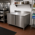 Thumbnail image #2 for BK Resources Enclosed Stainless Steel Work Table with Locking Cabinet Base, Hinged Doors, 5-Inch Backsplash, 18 x 30 Inches