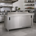 Thumbnail image #2 for Advance Tabco Enclosed Work Table with Sliding Doors, 96 x 30 Inches, 14 Gauge 304 Stainless Steel Top