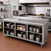 Thumbnail image #2 for Advance Tabco 108-Inch x 24-Inch Stainless Steel Work Table with Open Front Cabinet Base, Mid-Shelf, and 1-1/2-Inch Rear Up-Turn