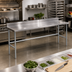 Thumbnail image #2 for Advance Tabco 12-Foot Wide 24-Inch Deep 16 Gauge 304 Stainless Steel Work Table with 5-Inch Backsplash and Galvanized Open Base