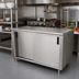 Thumbnail image #2 for Advance Tabco 60-Inch x 24-Inch Enclosed Work Table with Sliding Doors and 14-Gauge 304 Stainless Steel Top