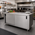 Thumbnail image #2 for Advance Tabco 144-Inch x 36-Inch Enclosed Work Table with Sliding Door Cabinet Base and 14-Gauge 304 Stainless Steel Top
