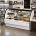 Thumbnail image #2 for True 77-1/4 Inch Dual Zone Dry/Refrigerated Curved Glass Full-Service Merchandiser Display Case, Self-Contained Refrigeration, Stainless Steel / White