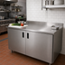 Thumbnail image #2 for Advance Tabco 144-Inch x 30-Inch Enclosed Stainless Steel Work Table with Cabinet Base, 14-Gauge 304 Top and 5-Inch Backsplash