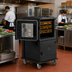 Thumbnail image #3 for Cambro Ultra Camcart 2-Compartment Front-Loading Heated Top-Door Food Pan Carrier, Heavy-Duty Casters, 110V, Black