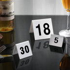 Thumbnail image #2 for New Star Foodservice Inc. 27648 Tent-Style Stainless Steel Table Numbers, 2" x 1-1/2", Numbers 51-75 Case of 12